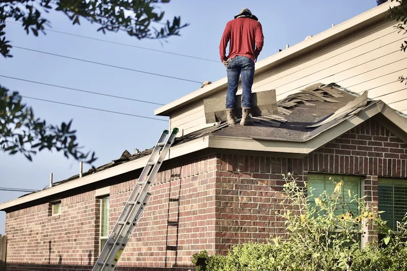 Professional roofer working on a residential roof in Landover Hills